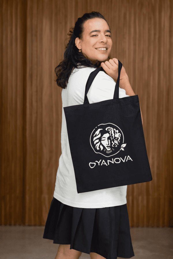 Model carrying Oyanova Black Tote